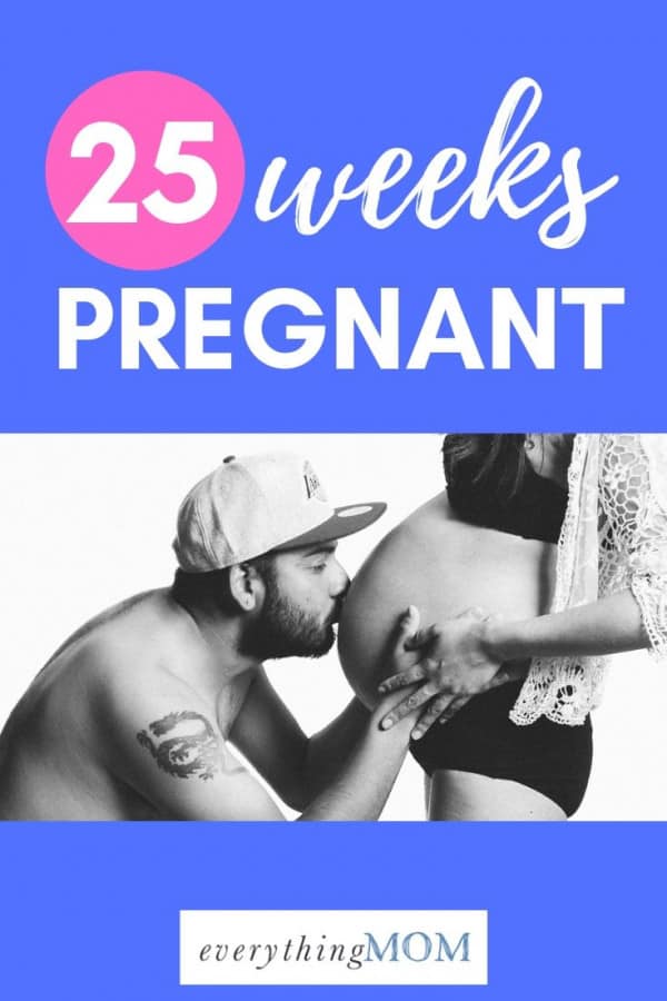 25 weeks pregnant man kissing wife belly