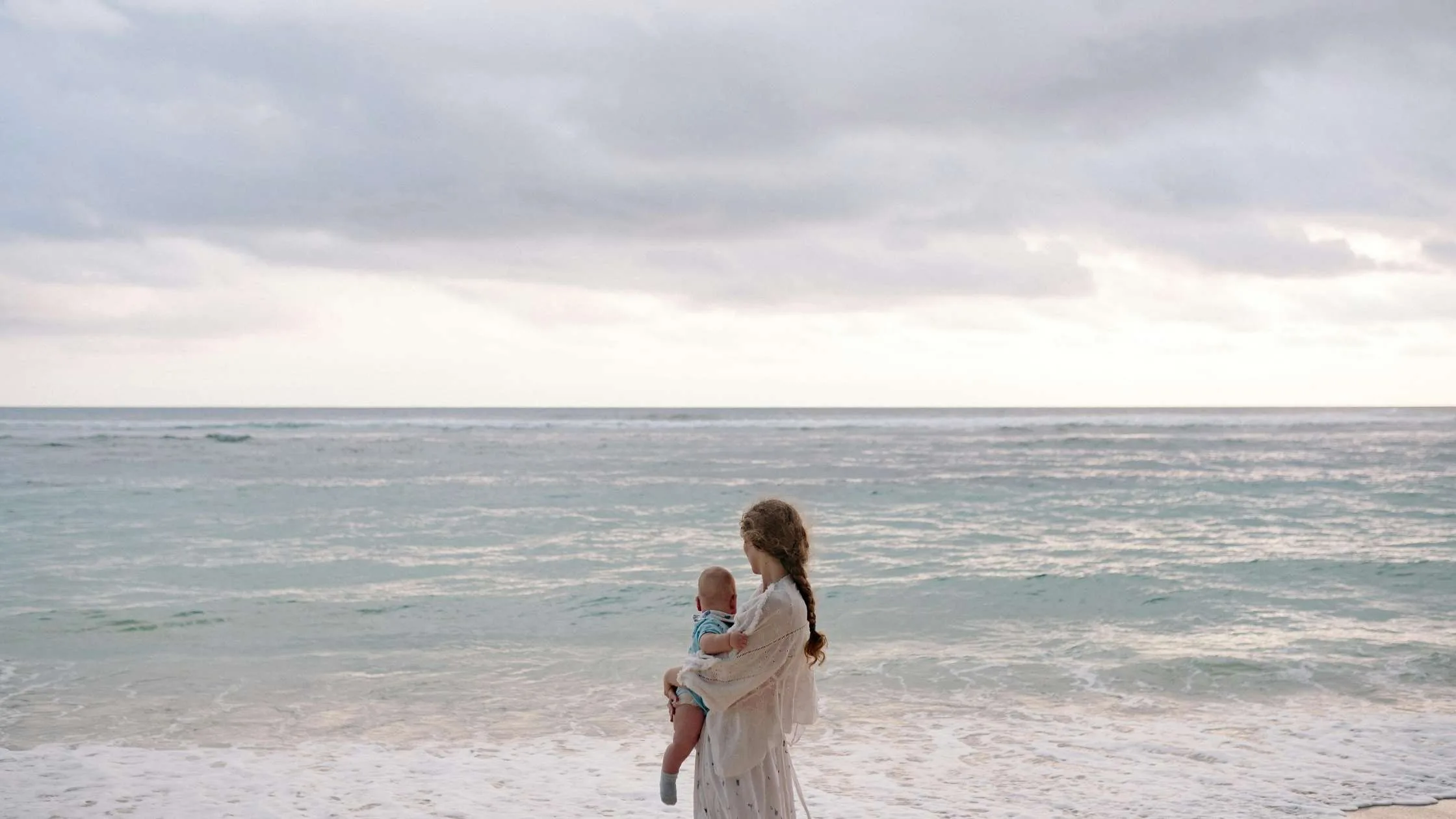 mom and baby water ocean